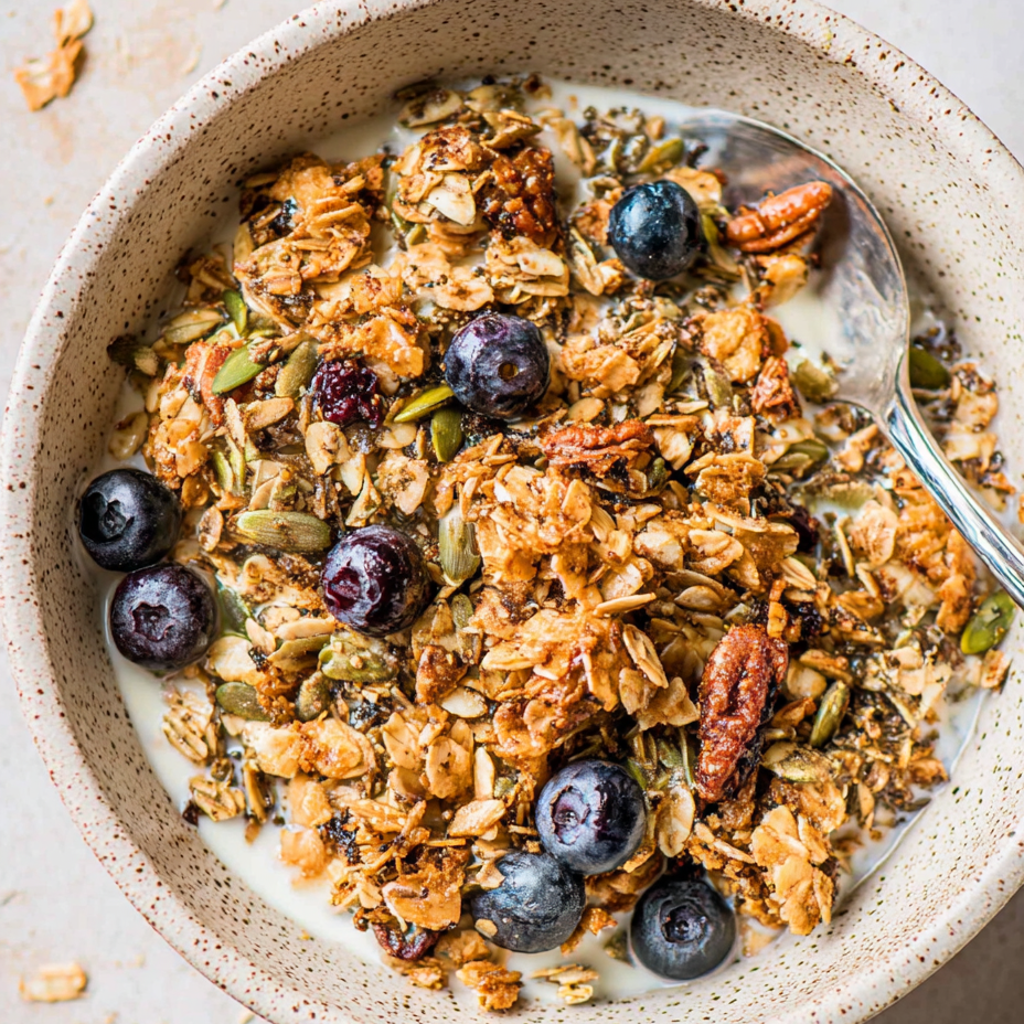 Crunchy hemp granola in a jar with nuts and coconut